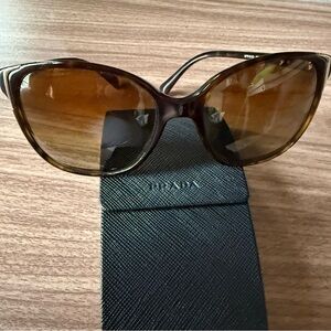 Prada Polarized Women’s Brown and Gold Sunglasses